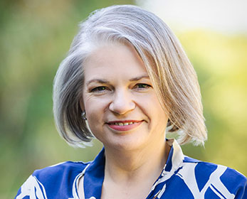 A professional portrait image of Ms Narelle Harvey smiling at the camera