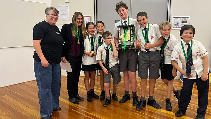 People standing in a line with awards.