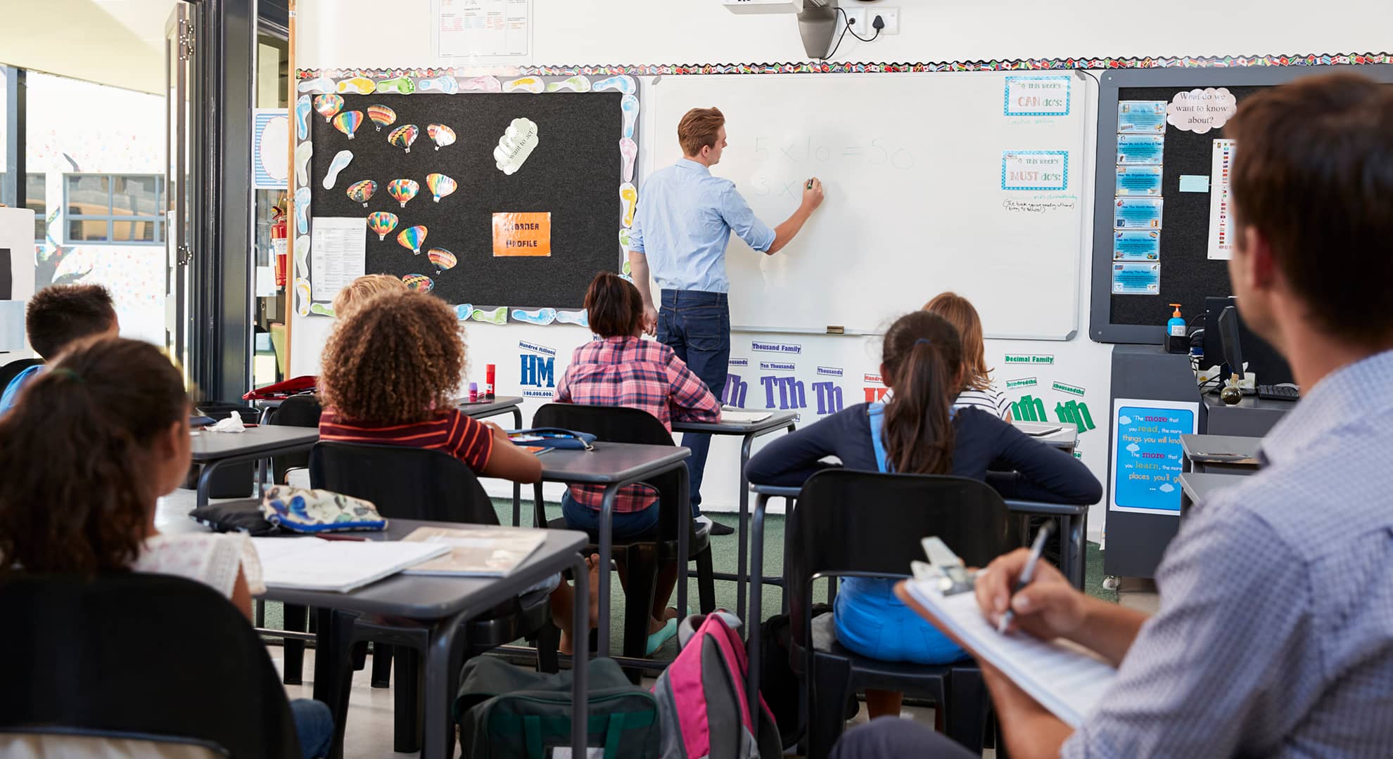 Students and teachers in classroom.