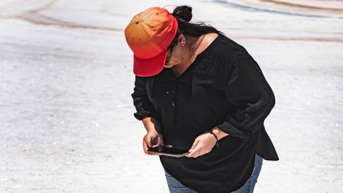A close up of a person taking a photo with their phone