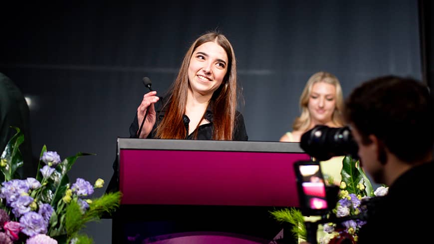 Young woman speaking at event