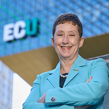 ECU Vice-Chancellor, Professor Clare Pollock stands in front of ECU City.