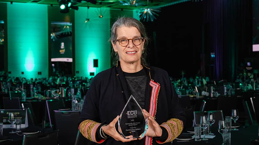 Woman standing with award
