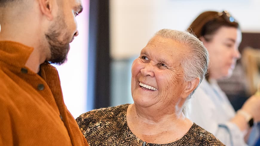 Older woman embracing a younger man