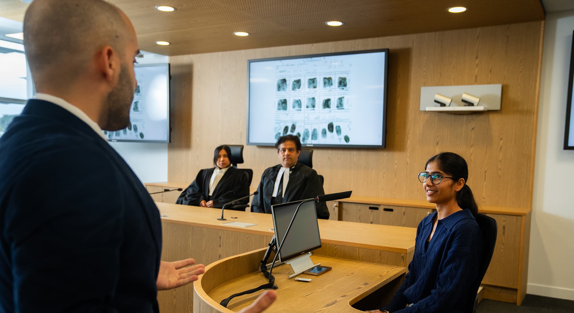 People in a mock courtroom