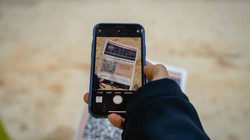 Mobile phone showing the Better Together QR Code