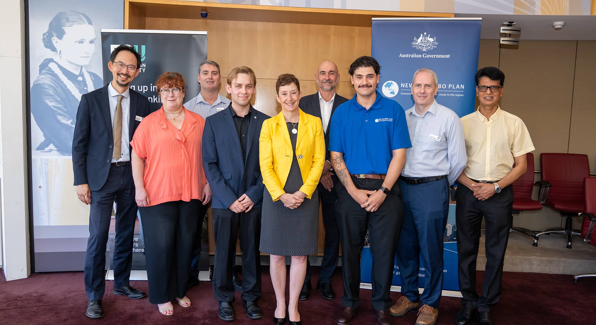 A large group of people standing in a row