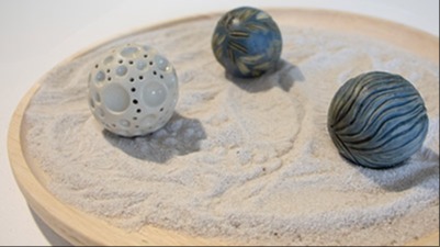 Photo of sculptured artwork on display in gallery exhibition