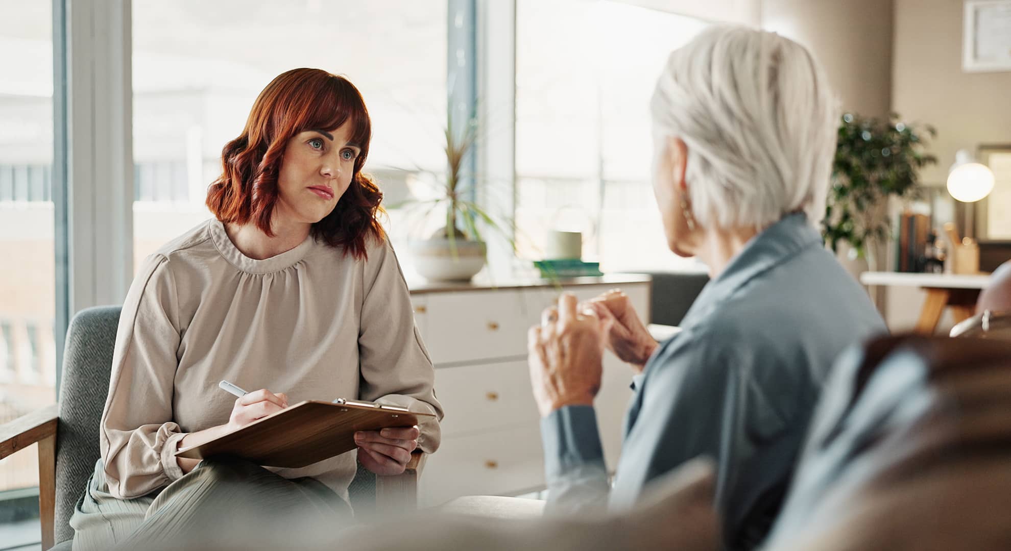 Psychologist speaking with an older person.