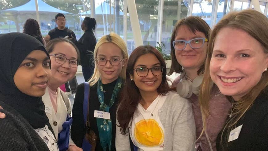 A group of women posing for a photo