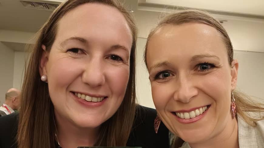 Two woman facing the camera