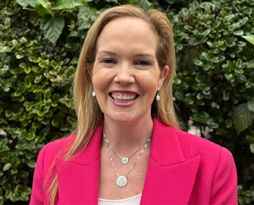 A Portrait image of Dr Sarah Jefferson smiling in front of a tree