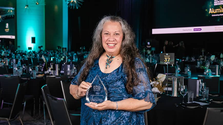 Woman standing with award