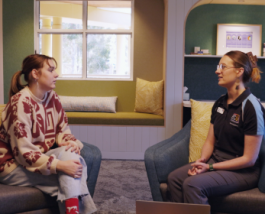 Two people sitting in calming room.