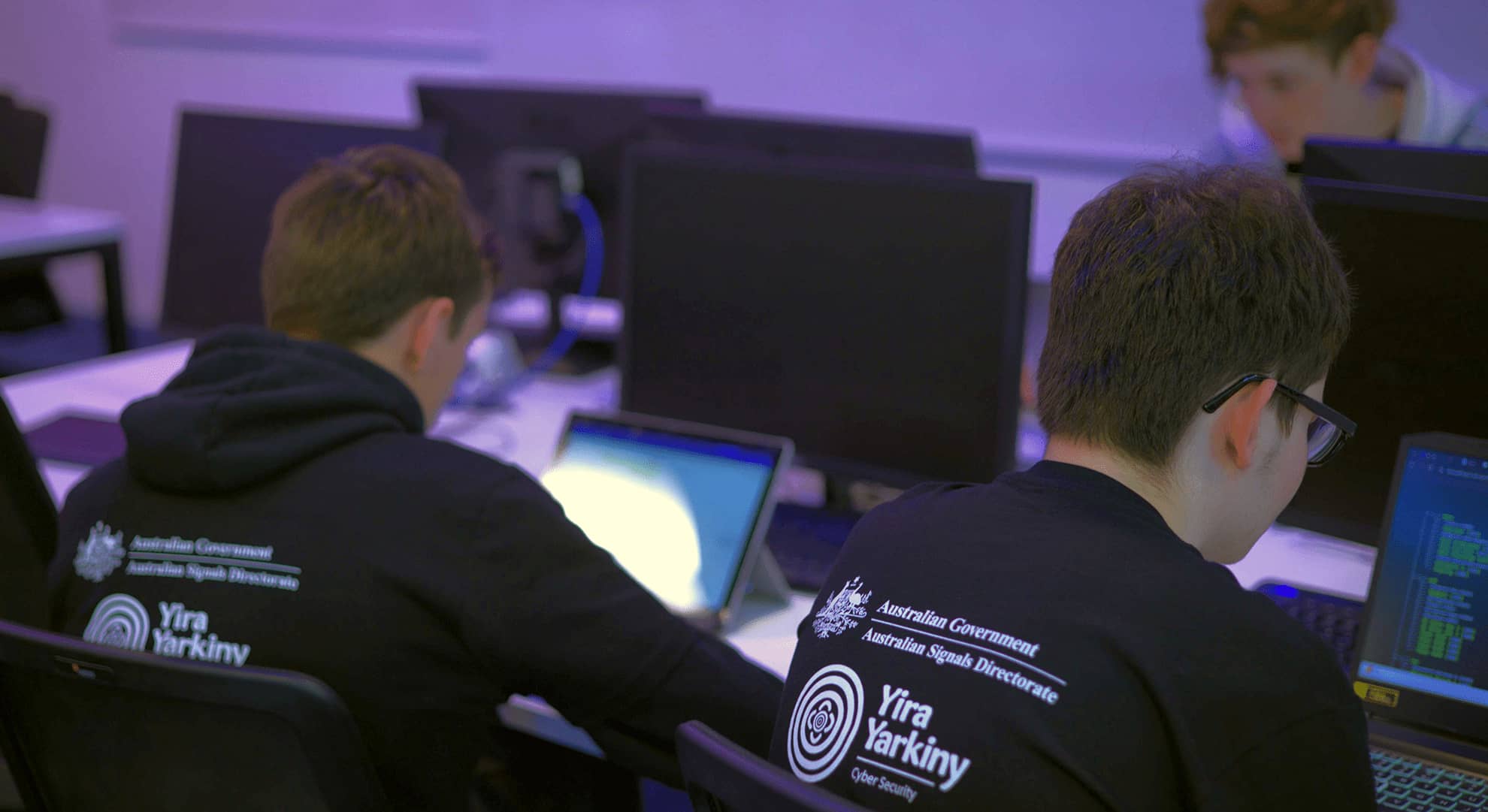 Teenage boys looking at computer screens