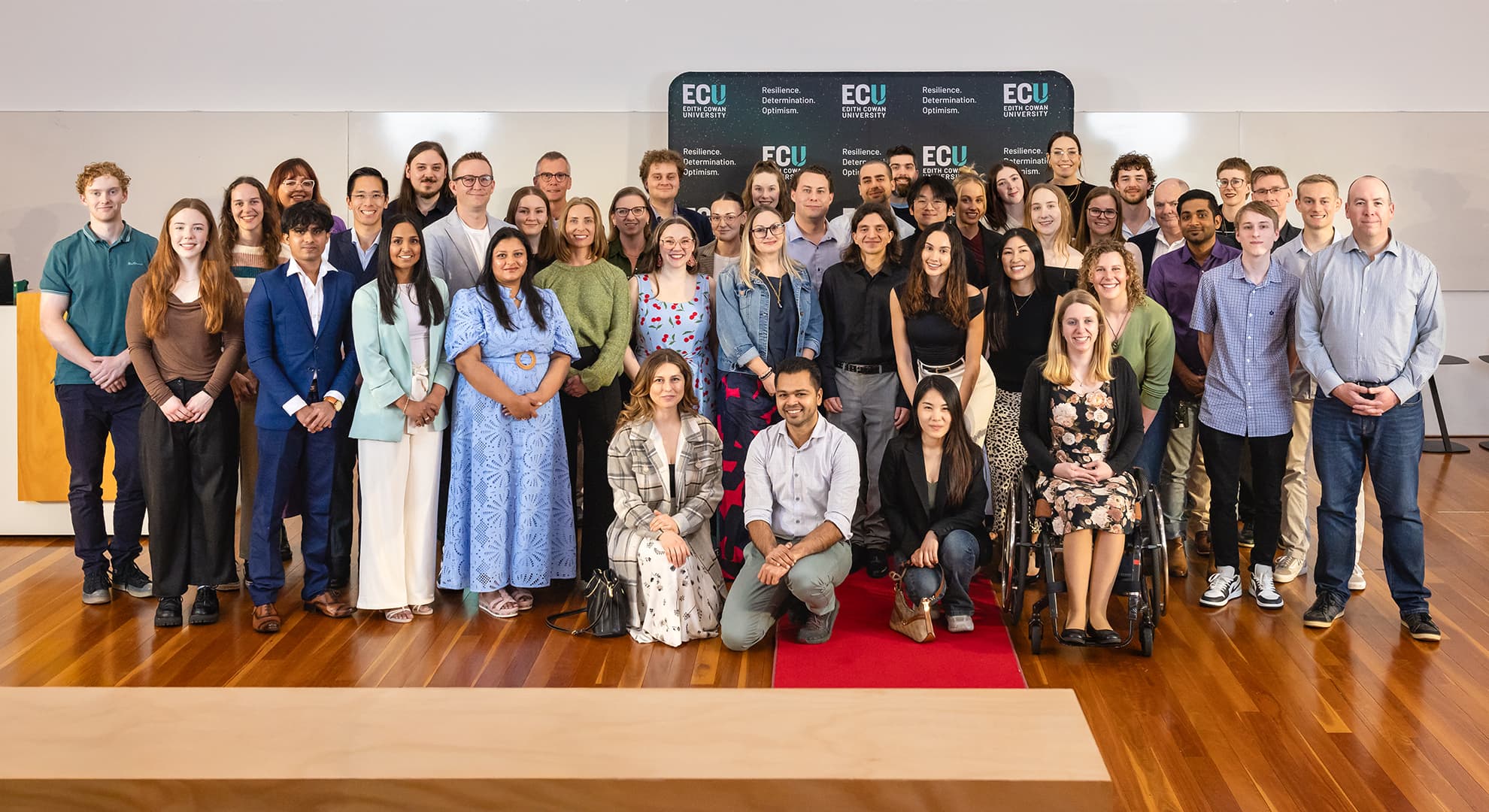 A large group of people at an awards ceremony.