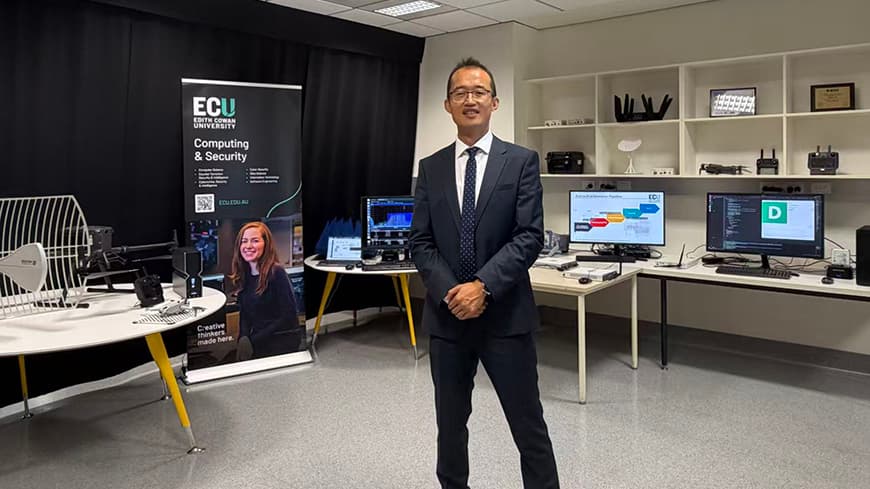 Man posing in a lab for a photo