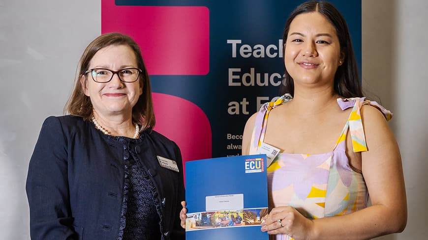 Two women at an award ceremony