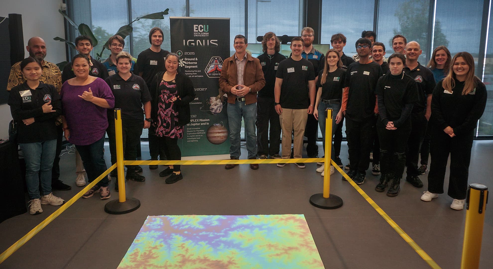 ECU staff and students in front of IGNIS stand