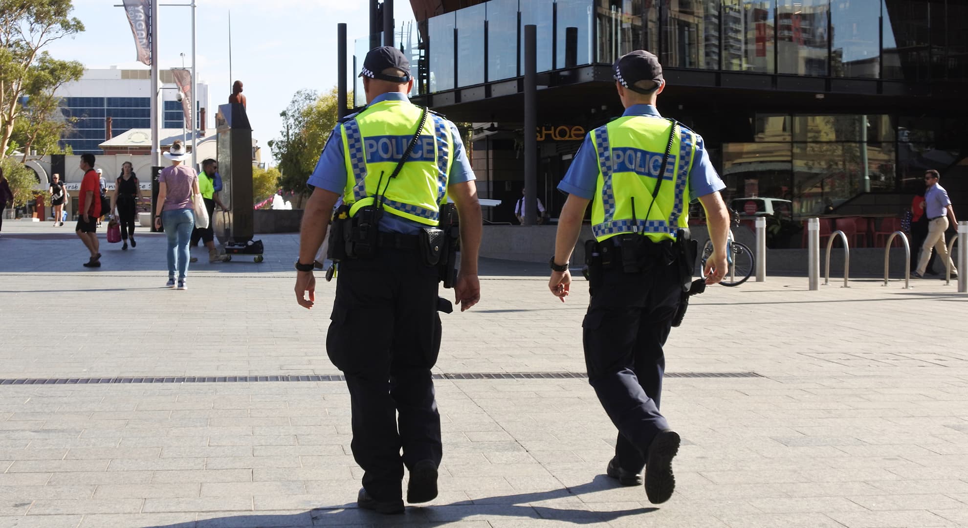 Two Perth police men walking