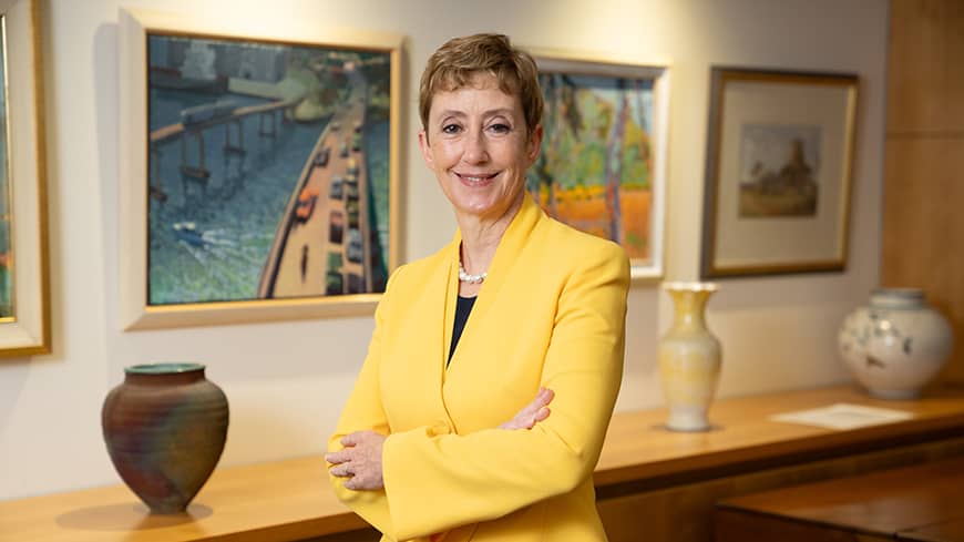 Woman in an office facing the camera