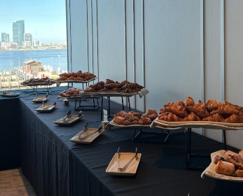 WIL Shaping Futures Industry Breakfast food at the table with a view of the city.
