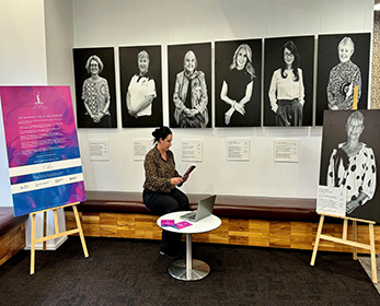 Person reading about the WA Women's Hall of Fame Awardees