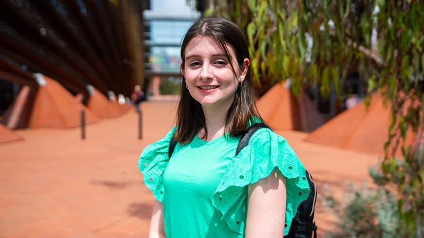 Student sonographer stands by building one at Edith Cowan University