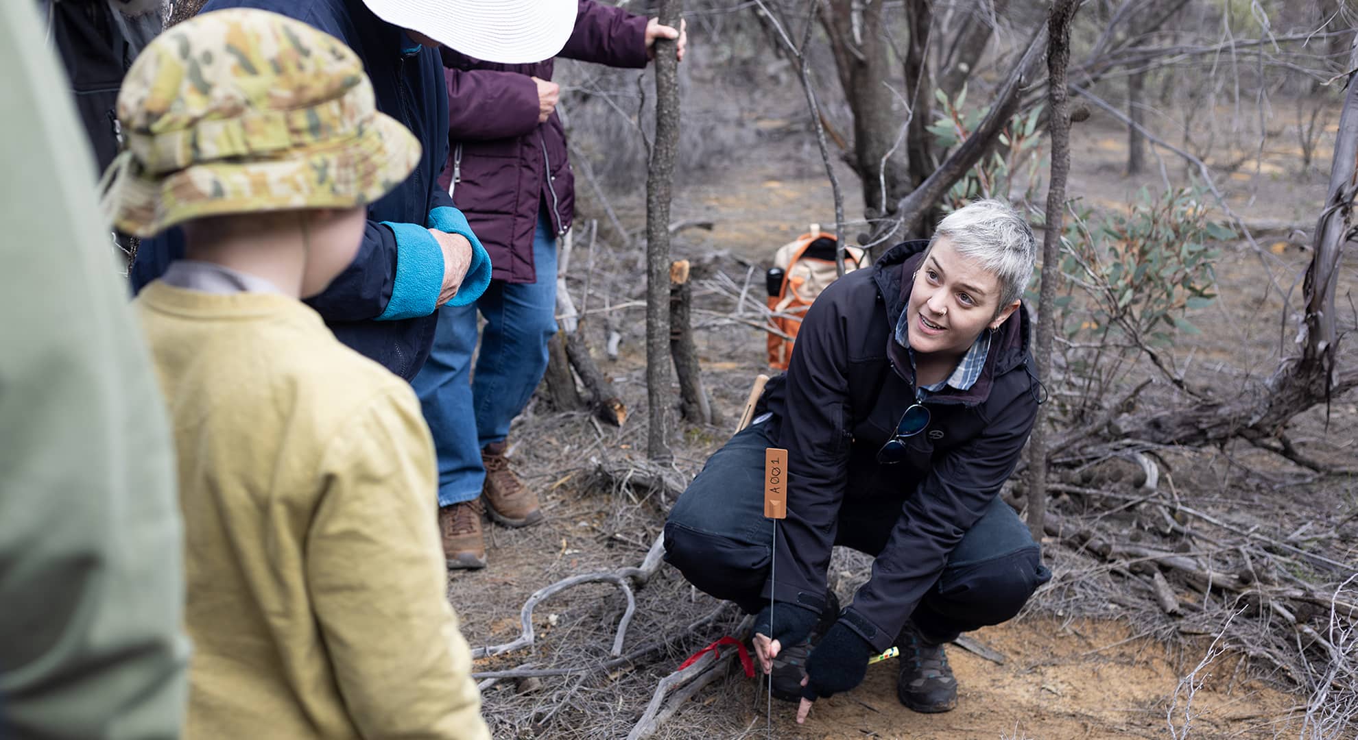 Scientist in nature reserve with volunteers