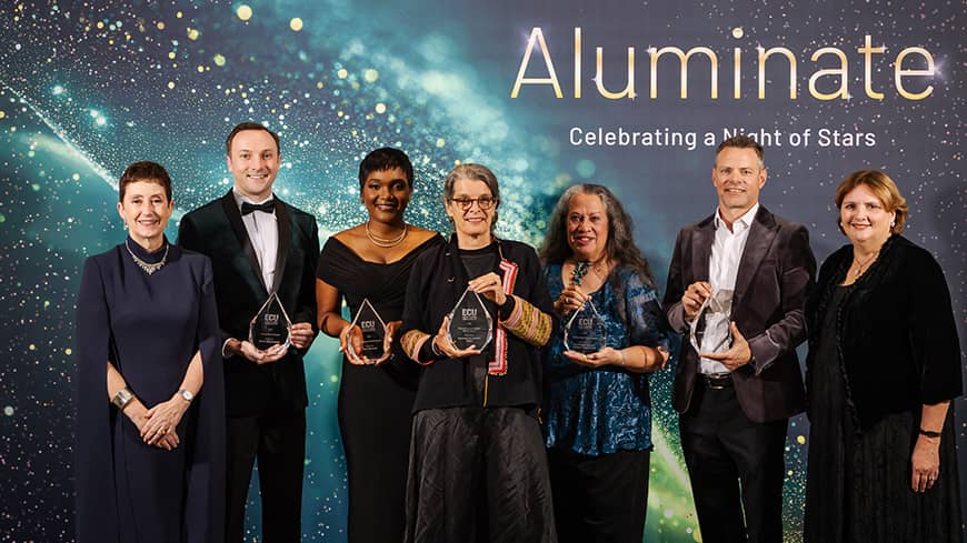 People standing in a line at an awards event