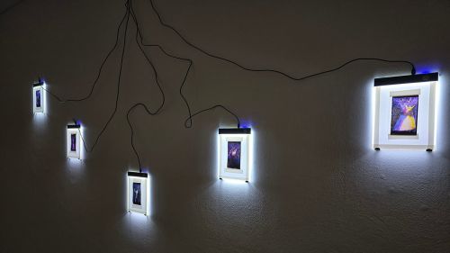 Photographic slides on lightboxes from pinhole camera recordings