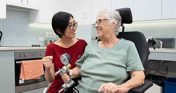 Physiotherapist helping an older woman