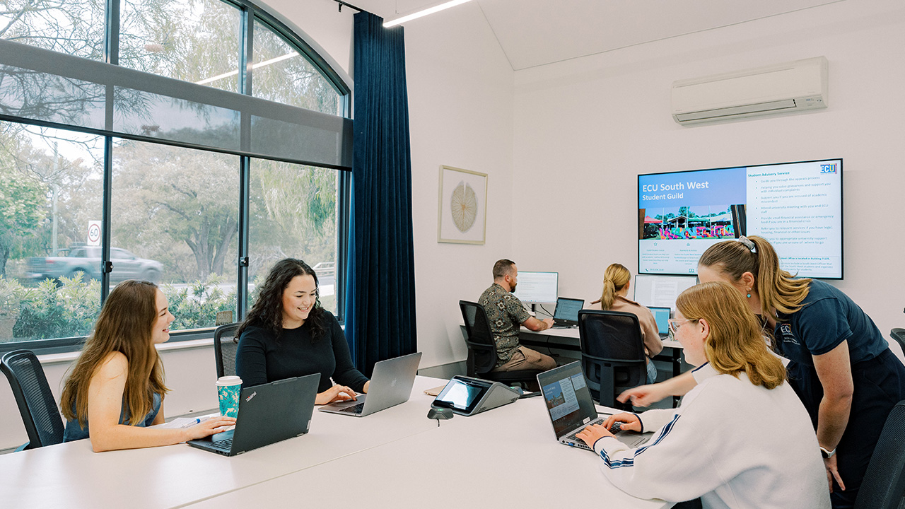 A classroom of students studying