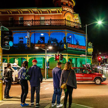 People in Northbridge in front of The brass Monkey Hotel.