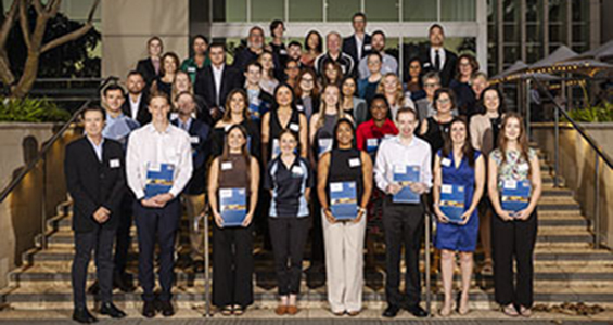 award winners standing on steps