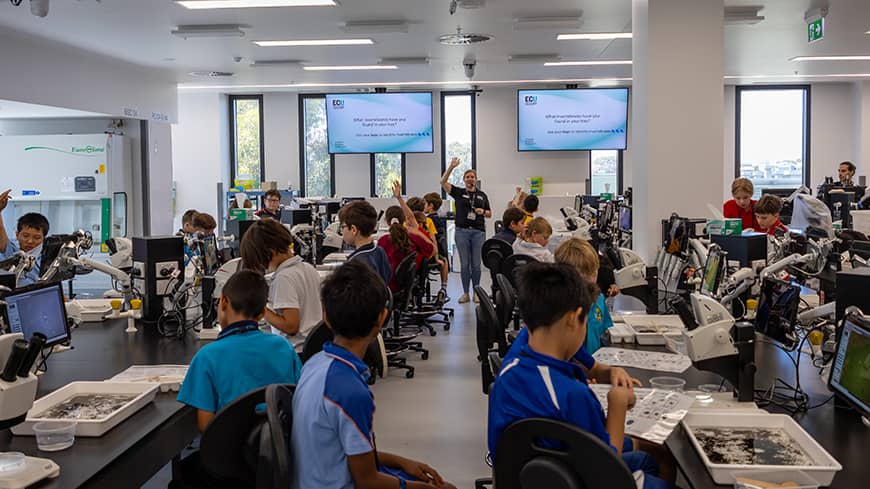 A teacher presents to a classroom of students