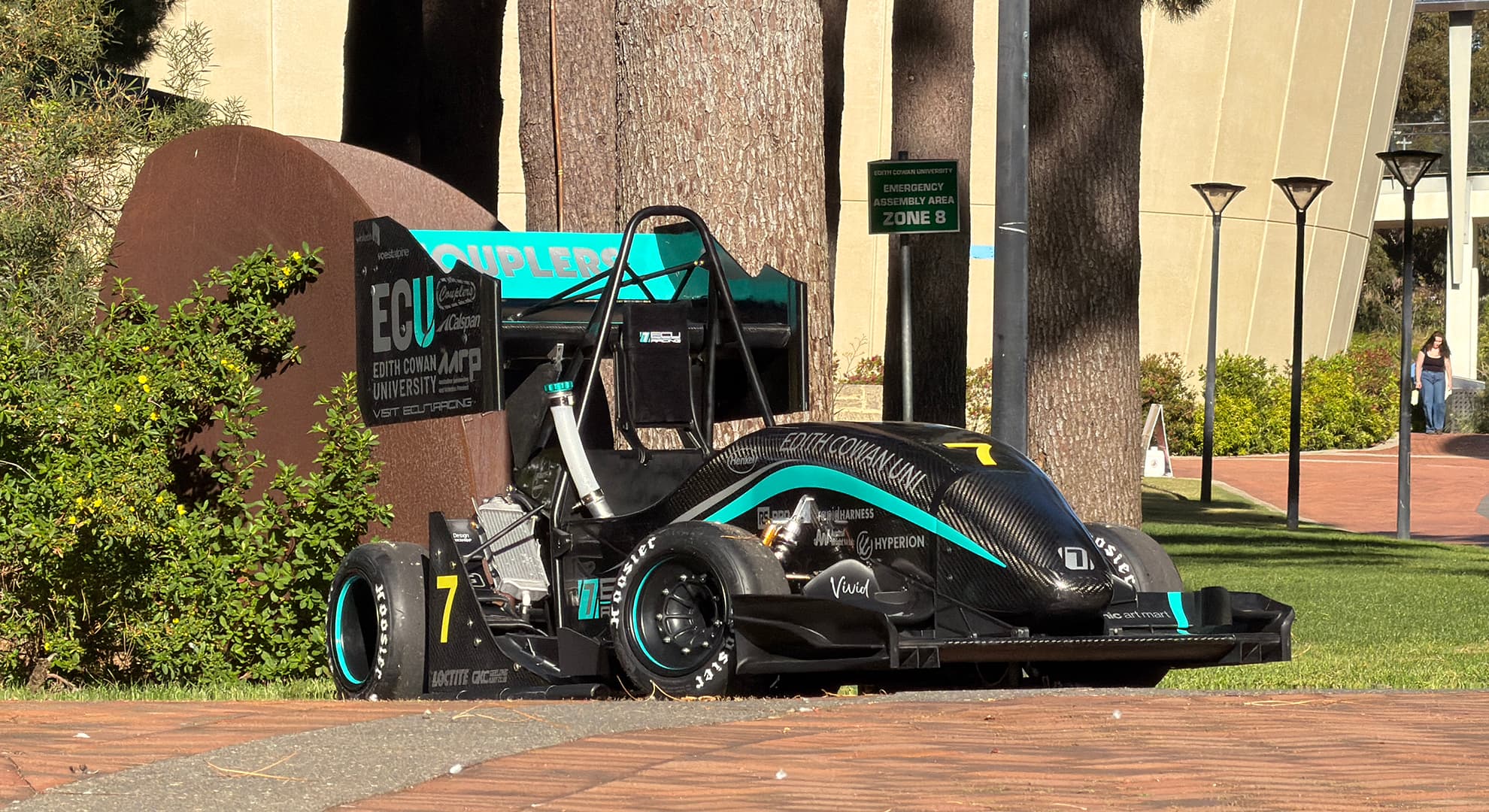 racing car parked outside building