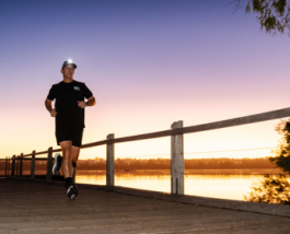 Professor Paulo de Souza running along boardwalk