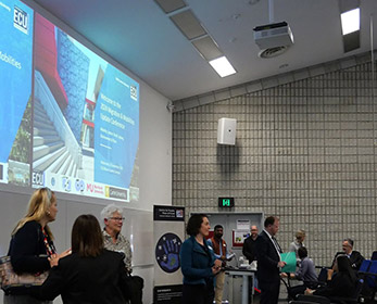 Photo of WA Migration conference held in a large lecturer theatre.