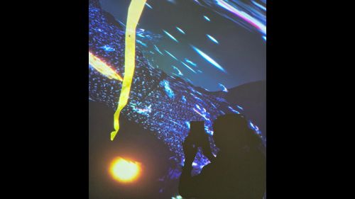 Person taking a photo of holographic image