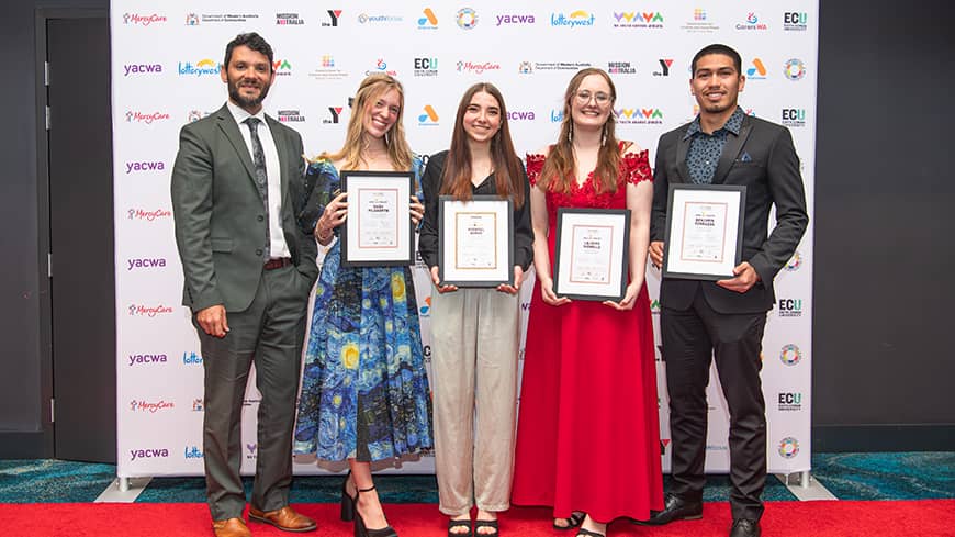 People standing with awards